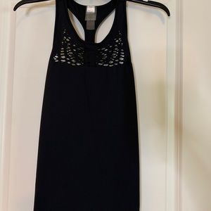Black athletic tank with mesh detail at collar.